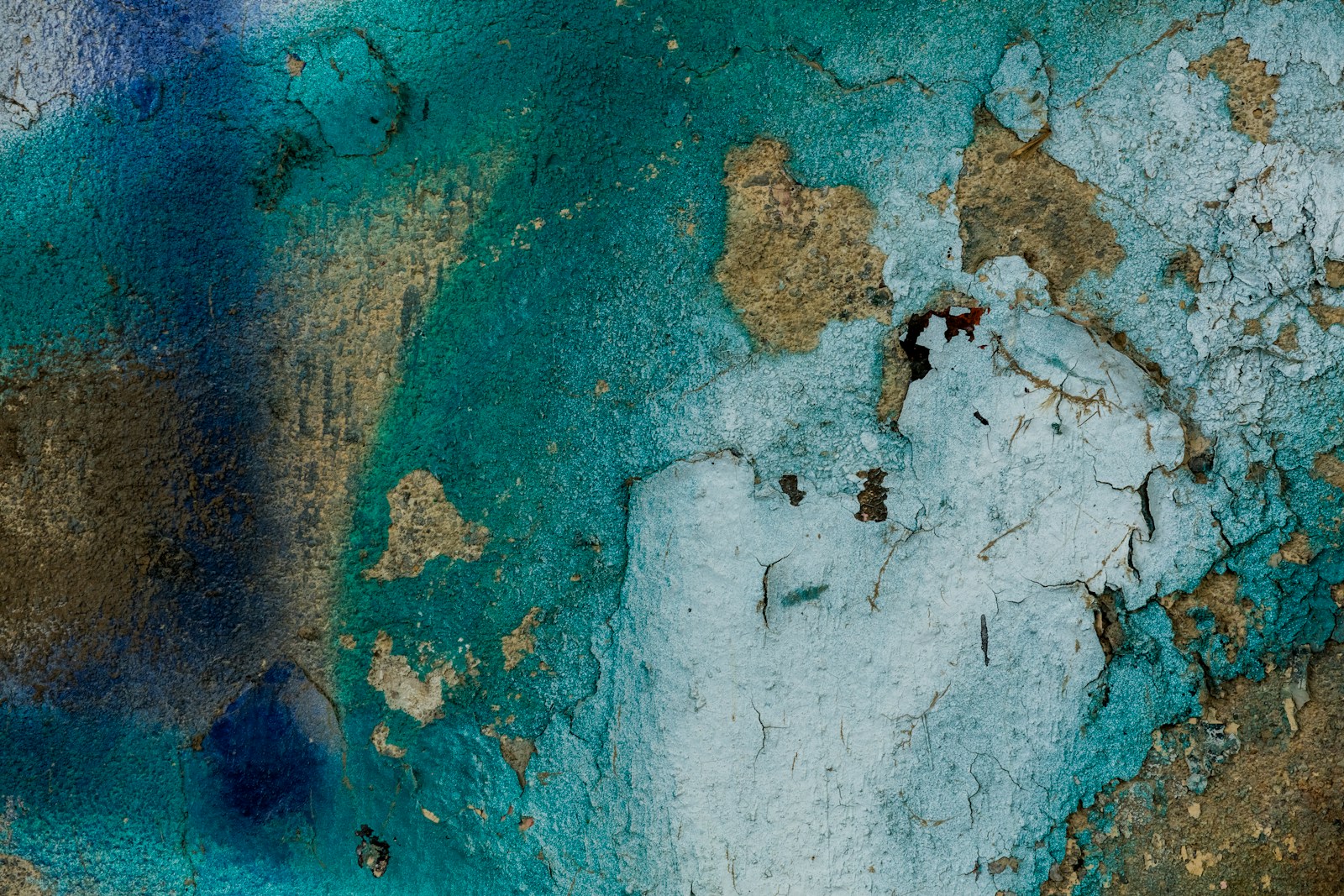 concrete with sprayed blue, teal, and white paint